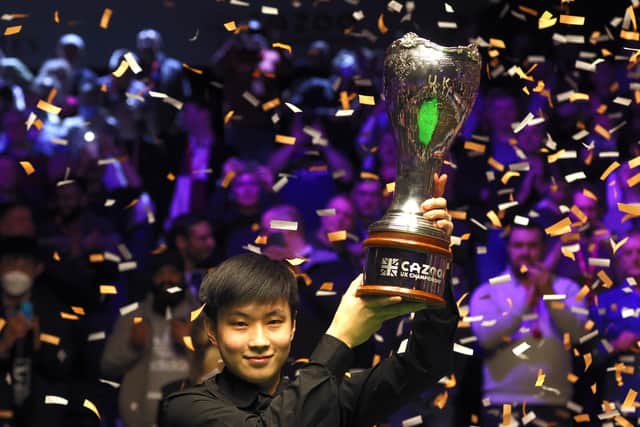 Zhao Xintong lifts the trophy after winning the final of the Cazoo UK Championship at the York Barbican. Photo: Richard Sellers/PA Wire.