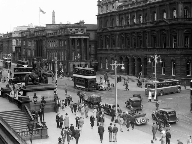 This 1940s view of the Waterloo Place and the GPO building from Register House at the East End of Princes Street shows how people of Edinburgh used all methods of transport - trams, buses, cars, horse and cart and bicycles.