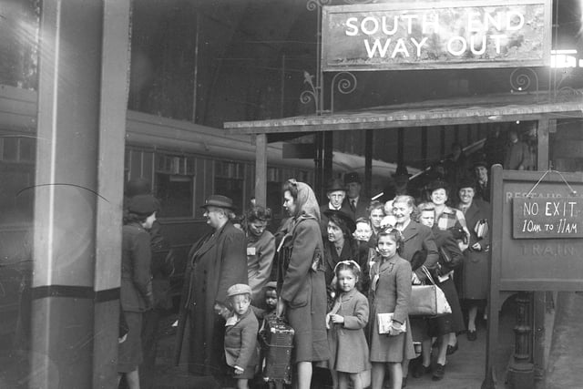 Evacuees go home to London a month after VE Day. Here they are waiting to board the train at Sunderland Central Station.