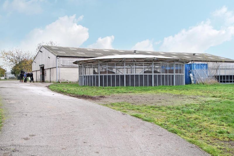 The extensive equestrian facilities include a round pen, for horse training.