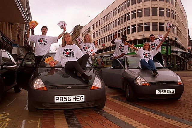 The Comic Relief 'Ka' team, who block off busy streets and bombard people with Comic Relief noses and leaflets until they are moved on by the police, are pictured on Fargate, Sheffield, March 13, 1997