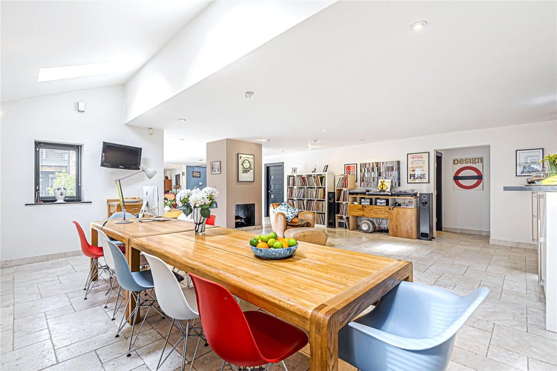 The kitchen opens up to a generous breakfast room and family dining area, providing plenty of space for entertaining.