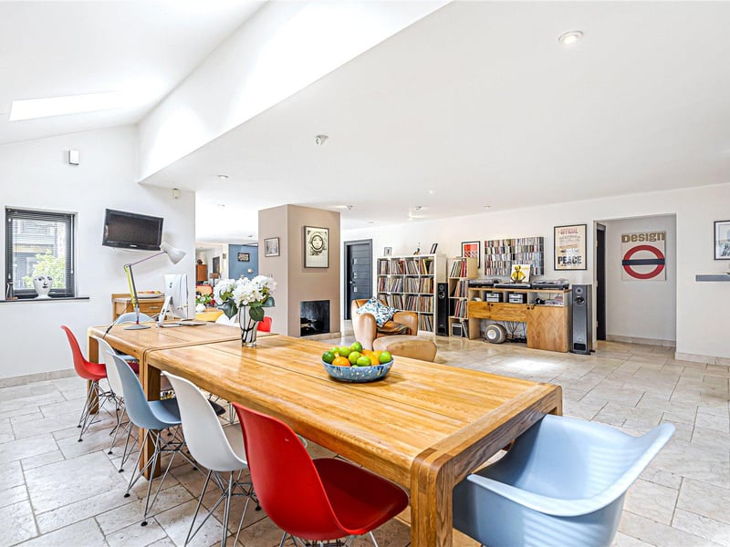 The kitchen opens up to a generous breakfast room and family dining area, providing plenty of space for entertaining.