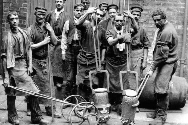 Sheffield Steelworkers at the start of the 20th century. Men with their crucible steel making tools. Crucible steel is steel made by melting pig iron (cast iron), iron, and sometimes steel, often along with sand, glass, ashes, and other fluxes, in a crucible.