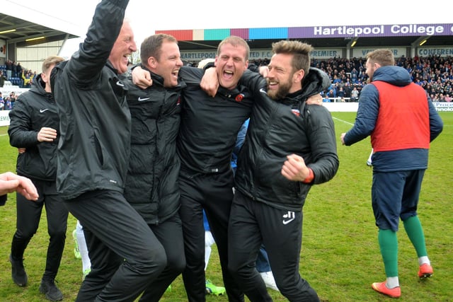 Hartlepool United manager Ronnie Moore celebrating with his staff at the end of the game against Exeter City which saw Pools retain their Football League status. Picture by FRANK REID
