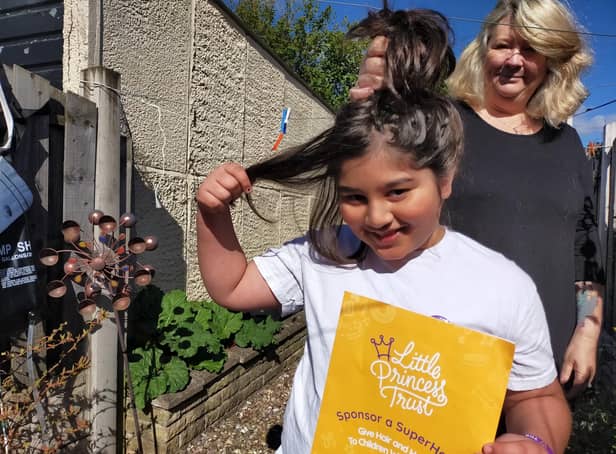 Thomas Houshmand, aged nine, is ready to lop off his 16-inches of hair to donate to the Little Princess Trust so it can be made into a wig for someone undergoing chemotherapy.