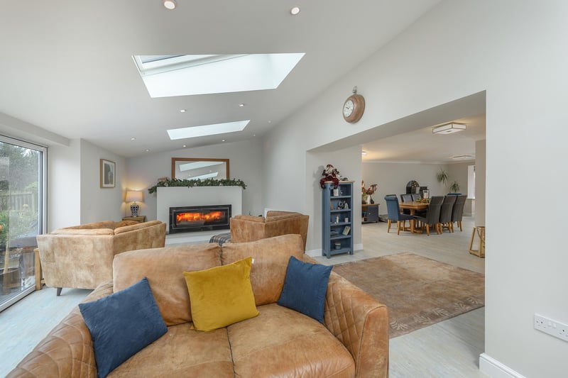 This area with its large picture window also boasts an impressive wood burner and access to the rear garden.