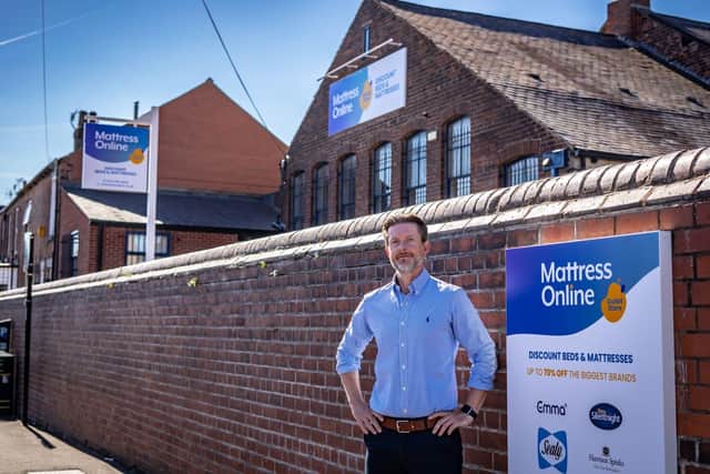 Mattress Online Chief Executive Officer Steve Adams outside the new outlet