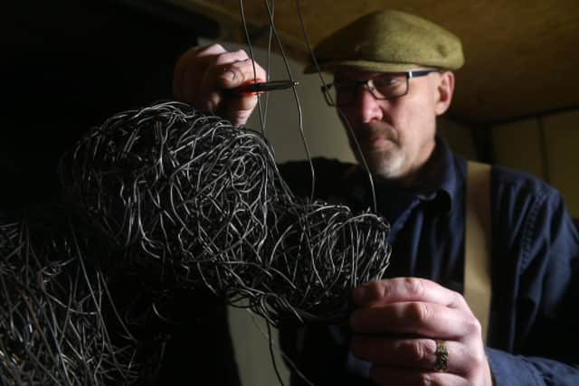 Sculptor Mark Irwin who makes sculptures out of wire pictured at his workshop at Pocklington