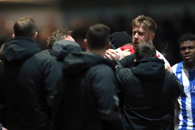 Fleetwood Town's Shaun Rooney had a fracas with Sheffield Wednesday's Darren Moore after being sent off. (Barrington Coombs/PA Wire)