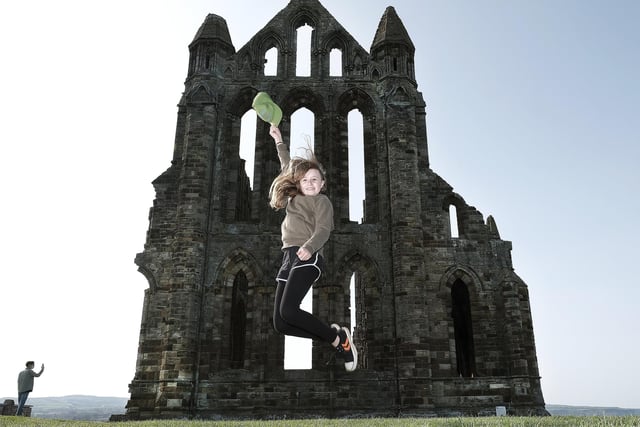 Whitby Abbey is a fantastic English Heritage site. Follow in the footsteps of artists, writers and religious leaders to explore the soaring gothic ruins and to take in the stunning sea views. Visitor Lucy is pictured leaping with joy at the Abbey reopening. Picture: Richard Ponter