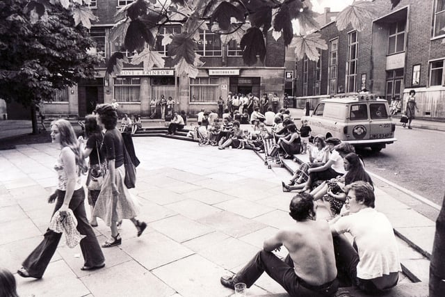 People enjoying and relaxing in the sun just outside the Dove and Rainbow in 1978.