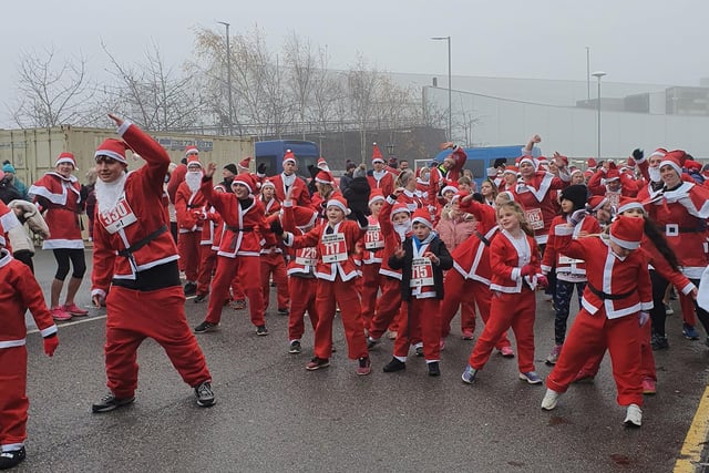 All the Santas warming up at the Technique Stadium before the run