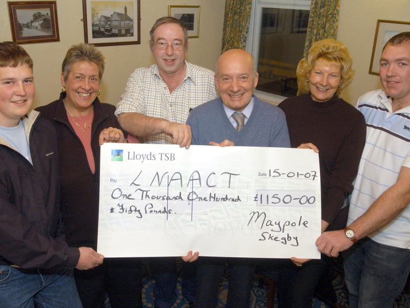 John Field, third right, receives £1,150 for the Lincolshire and Nottinghamshire Air Ambulance which was raised over Christmas 2006 at The Maypole at Skegby. Handing the money over were Tom Mattison, Sharon Cooper, Tony Miles, landlord, Christine Lakin and Richard Bates.