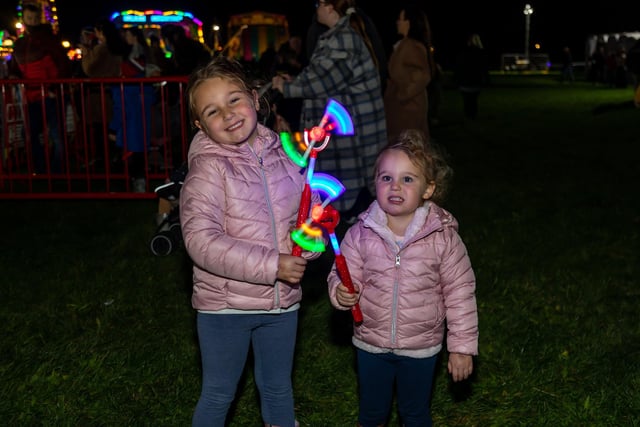 Four year old Cami Owens, and two year old Lexi Owens, enjoyed the fairground while waiting for the fireworks.