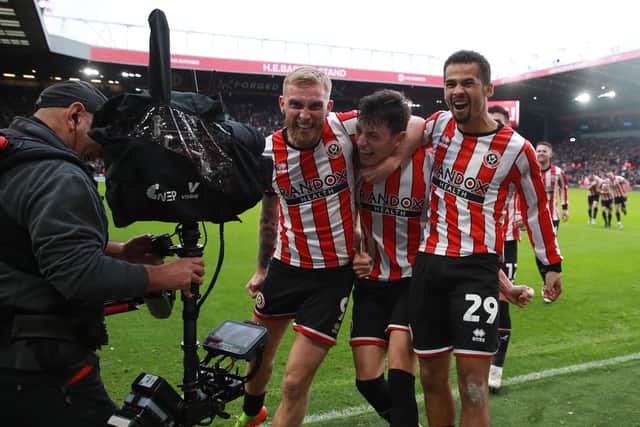 Sheffield United's Anel Ahmedhodzic (C) with Iliman Ndiaye (R): Simon Bellis / Sportimage