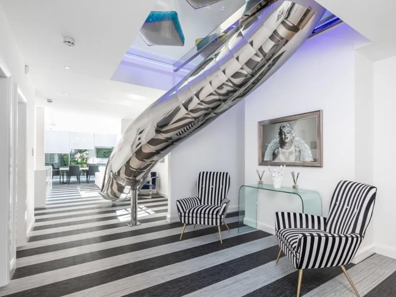 This house is stunning throughout and it even comes with an indoor slide.