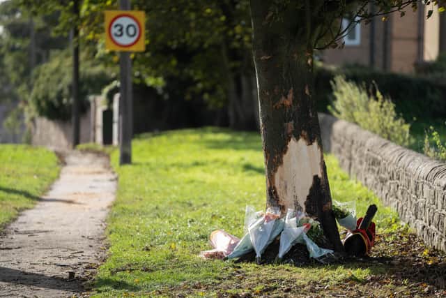 Tributes at the scene of a crash in Kiveton Park, Rotherham, in which three teenagers died (pic: Tom Maddick / SWNS)