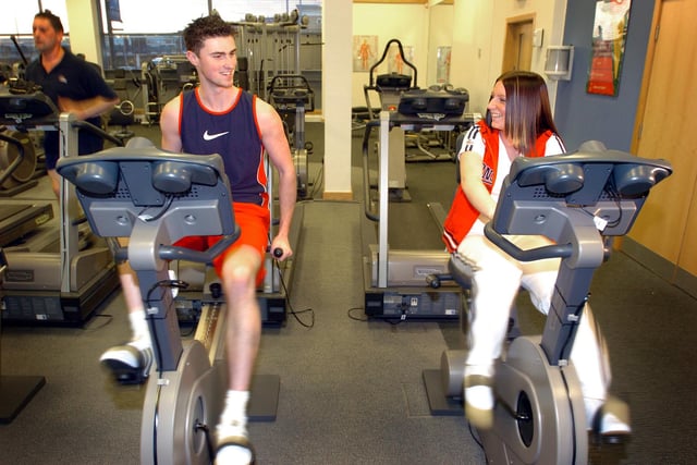 People on the exercise bikes at the Source Gym, Meadowhall in 2005