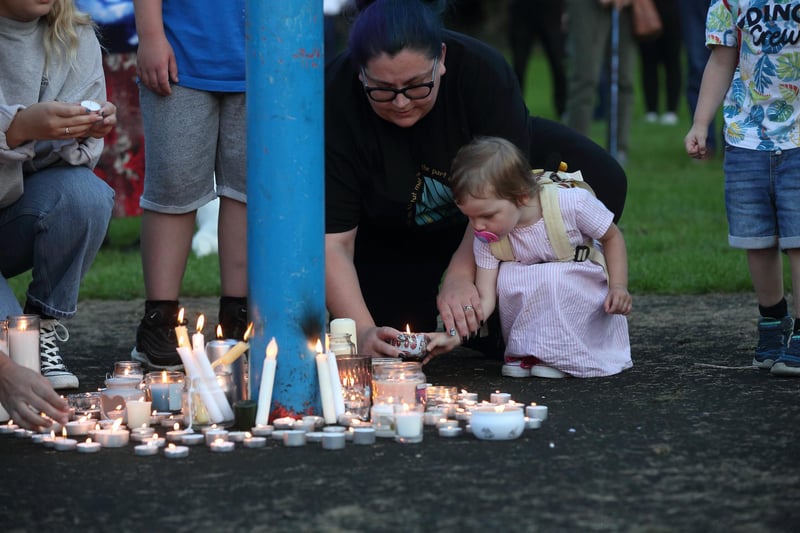 Many took it in turns to place candles during the vigil for the Killamarsh victims on Monday evening.