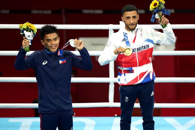 Great Britain's Galal Yafai (right) celebrates with the gold medal and Philippine's Carlo Paalam with the silver model after the Men's Fly (48-52kg) Final Bout at the Kokugikan Arena on the fifteenth day of the Tokyo 2020 Olympic Games in Japan (pic: Mike Egerton/PA)