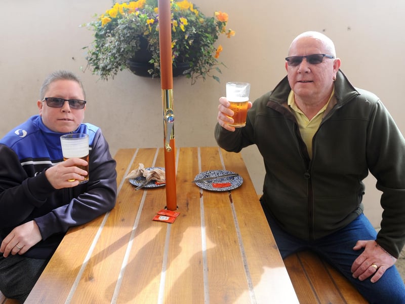 Julieanne Edwards (40) with her dad Stephen Edwards (59) both from Leigh Park, enjoy a catch up over a pint at The Parchment Makers in Park Road South, Havant. Picture: Sarah Standing (120421-6489)