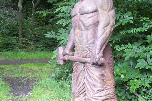 The statue, made of cast iron and designed by Jason Thomson in 2001, depicts a large man, stripped to the waist and wielding a sledgehammer; it weighs over 3 tonnes and is over 3 metres high.[3] It was originally commissioned by the Sheffield City Council Heritage Woodland Team,