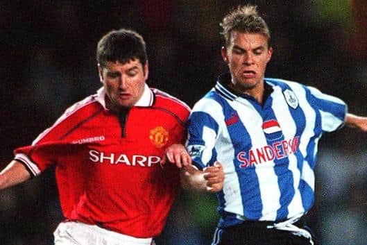 Sheffield Wednesday's Niclas Alexandersson scored two up against Denis Irwin in the Owls' memorable 3-0 win over Manchester United.