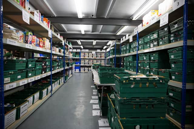 Shelving full of donate food in a food bank warehouse