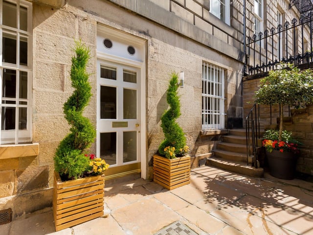 The garden is described as “ideal for al fresco dining”. It provides lovely green space in the heart of Edinburgh, and it leads to private, off-street parking. At the front of the house, there is a patio area and three under pavement cellars.