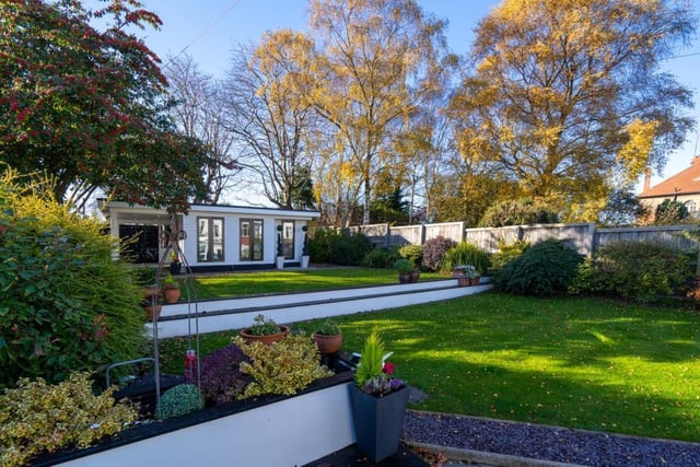 The mature garden to the rear has an abundance of plants, trees and shrubs in addition to a generous multi levelled lawn.