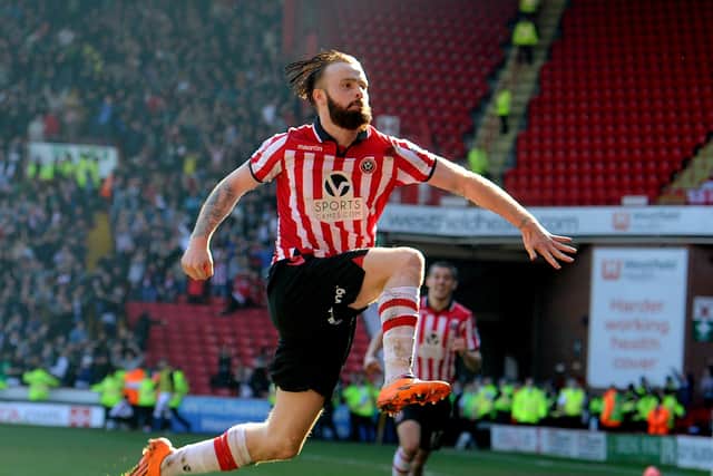 Sheffield United's John Brayford leaps into the air to celebrate scoring the second goal of the quarter-final against Charlton Athletic