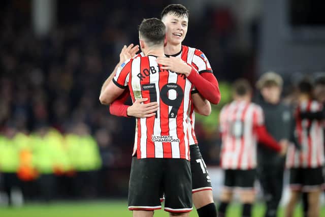 Sheffield United's Jack Robinson (left) and Anel Ahmedhodzic celebrate after the final whistle following the win over Spurs: Simon Marper/PA Wire.