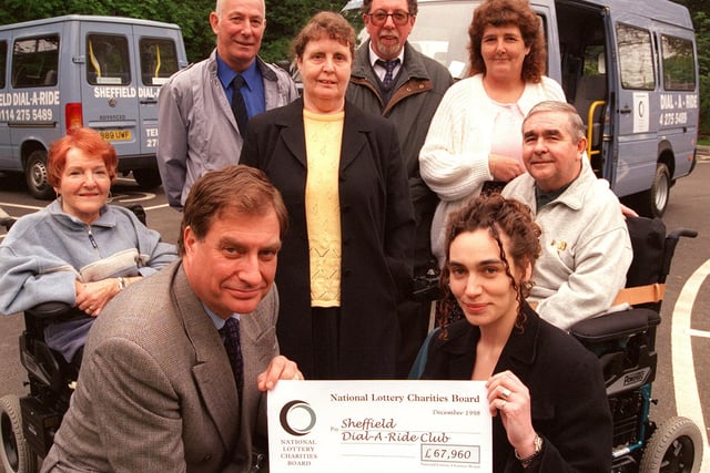 Lucy Wurstlin of the National Lottery Charity Board handed over a cheque to Nicholas Hotton MBE Chairman of the Sheffield Dial a Ride Scheme in 1999. Looking on are Dial a Ride Committee members and helpers Ken and Ada Melluish.June Eckhart,David Andrews,Mick Letcher and Dawn Guest at a ceremony held at the Beech Hill Respite and Day Care Centre Norfolk Park Road