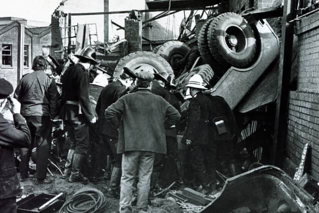 Firemen trying to free the body of a crane operator who was killed in the explosion at Effingham Street Gas Works, Sheffield, October 24, 1973