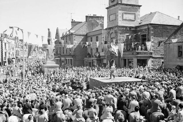 Selkirk Common Riding, June 1955. The standard bearer casts the colours.