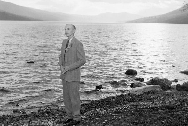 Sir Alec Douglas Home stands at the side of Loch Tay while campaining for  the Kinross and West Perthshire by-election.