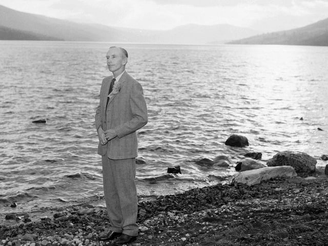Sir Alec Douglas Home stands at the side of Loch Tay while campaining for the Kinross and West Perthshire by-election.