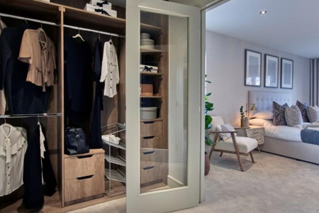 The master bedroom has double doors which open through to a dressing room area with matching wardrobe space on either side wall.
Image by Robertson Homes.
