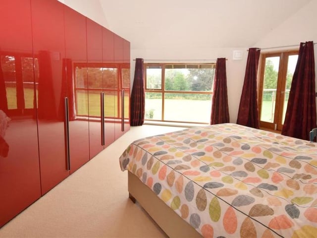The master bedroom has French doors that open on to a balcony, which is the perfect spot for a morning coffee or evening glass of wine while taking in the beautiful countryside views. Fitted wardrobes and windows to the front and back are added bonuses.