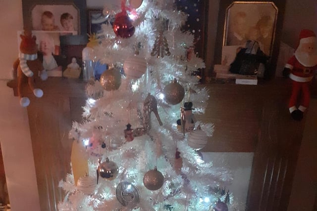 One red bauble shines out on a white tree surrounded by pastel coloured decorations on Vicky-Louise Chance's tree.