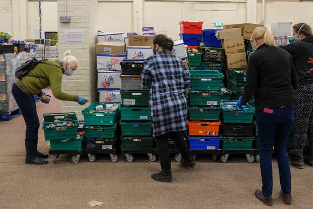 S6 Foodbank in Hillsborough
Volunteers pick parcels for the clients they serve from the foodbank