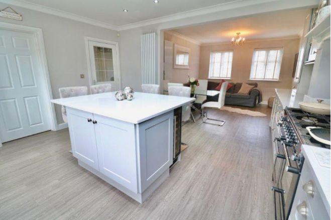 The large living kitchen offers lots of light and is a spacious place to cook, entertain and socialise.