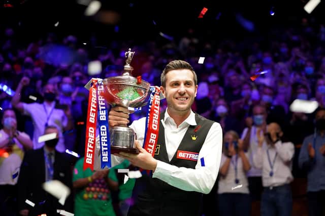 England's Mark Selby with the World Championship trophy won in front of fans in Sheffield's Crucible Theatre on Monday