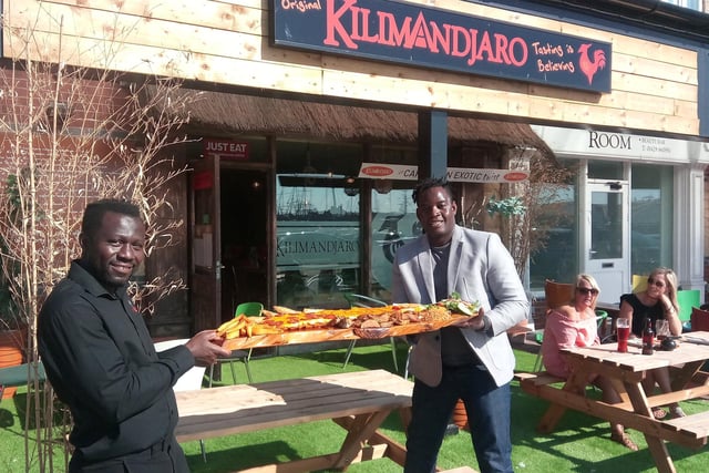 Apollo Ouedraogo (right) and Claudio Andre laid down the Super Mighty Parmo Challenge to diners at Kilimandjaro African themed restaurant in summer 2017.