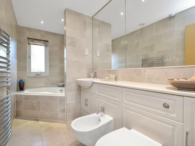 This four bedroom townhouse is on sale for £515,000 in Port Solent. It is listed by Fine and Country.