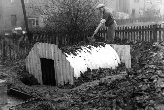 Many families had air raid shelters outside their homes. Here's one being built in March 1939 .