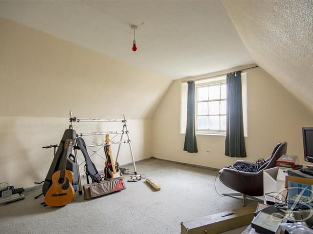 There are two attic rooms which are currently being used for storage.