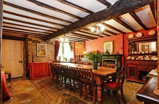 The large dining room has a massive, heavy oak beam in the centre, with an original stone-flagged floor. There is also a painted slate fireplace with stone hearth and inset dog-grate for a real fire, which again is subject to a preservation order.