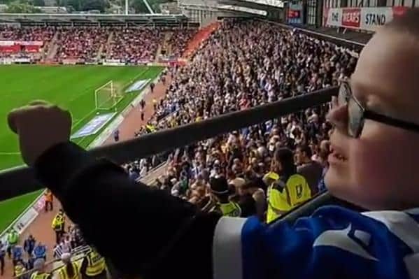 Owen Hughes, seven, cheered on Sheffield Wednesday's win at Rotherham United on Saturday.